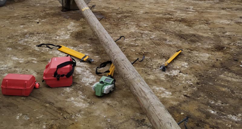 Leica Total Station with broken tripod on the ground